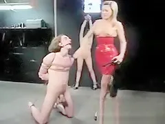 Dominatrix has two slaves to master