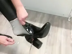 In changing room ... Should I buy these shiny boots?