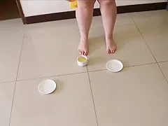 Fat milf pee's in a cup of tea and then plays in it with her feet