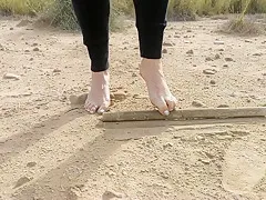Super slow motion feet walking on dusty ground -- DIRTY FEET