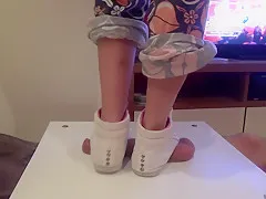 Girl in sneakers trample on cock and balls. Ends bootjob and cumshot
