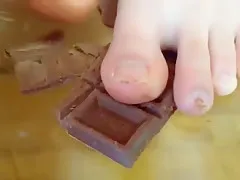 Asian wife jokes with her husband and tells him to lick his feet