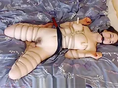 Dildoed and whipped in Bondage
