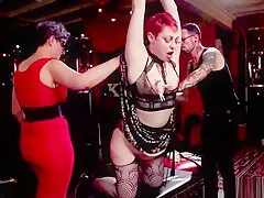 Redhead and ebony fucked at bdsm orgy