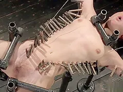 Slave in strait jacket whipped in bondage