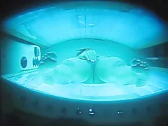 PEEPHOLE CAPTURES WIFE MASTURBATING IN TANNING BED