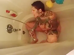 Chubby tattooed milf squirts in shower 2 times. Sexy feet.