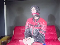 Sexy Pia Being Tied And Gagged On A Chair Wearing Sexy Shiny Nylon Rainwear (Video)